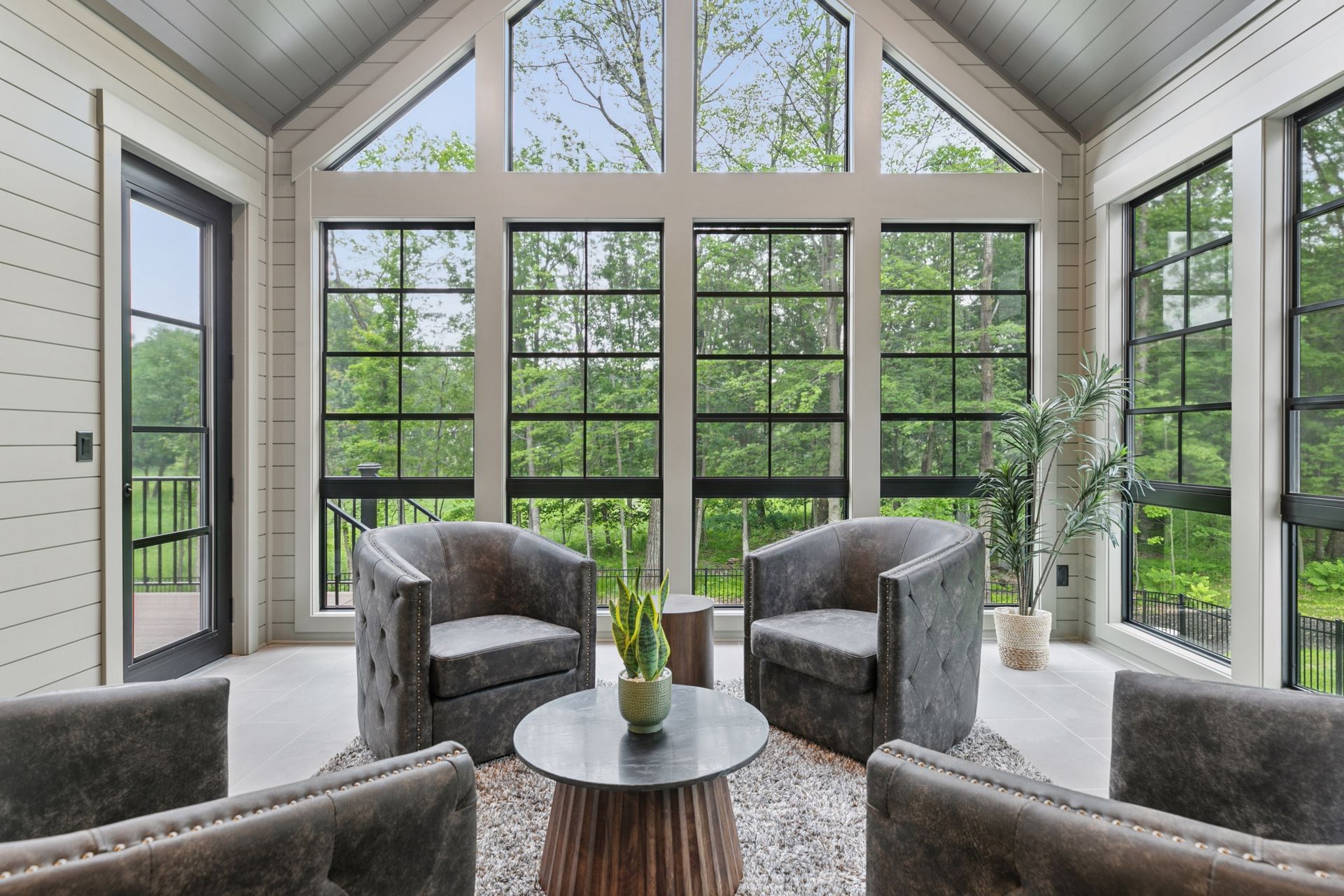 Three-season porch with full wall of windows